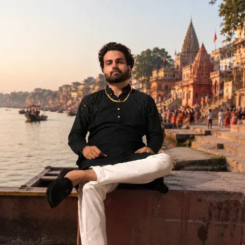 Amit Kumar Deshwal — founder of Ayodhya Varanasi Guides, photographed on the ghats of Varanasi